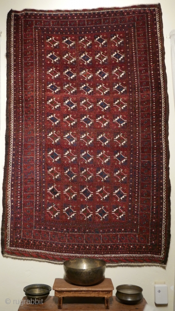 Elegant Baluch rug with Turkmen guls and kochaks from areas bordering Afghanistan;  fine weave;  five colors,  all natural;  handspan wool;  normal oxidation of the brown appropriate to  ...