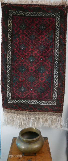This is a very plush Baluch 'ballsht' with a high and lustrous pile,  blanket-like;  colors - two of aubergine, blue-green,  reddish-orange and white - are deep,  rich and  ...