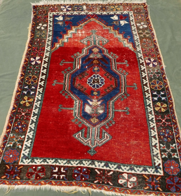 Central Anatolian prayer rug,  based on a Yastik design,  circa mid 19th c, if not earlier,  with a handle like a hanky,  and marvelous colors:  a brilliant  ...