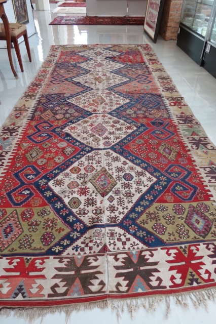A large and fine Cine-Aydin (?) kilim. Two panels expertly joined. wonderful colors and decorated with many whimsical motifs. 

13'4" x 5'3"
           