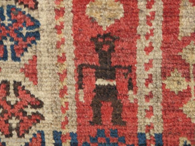 very beautifull rug.kurdish?caucasian?it has great colours and a rare abrash.the abrash is mainly at the narrow border.it has two human figures.one end is cut but the rest is in great condition,super quality  ...