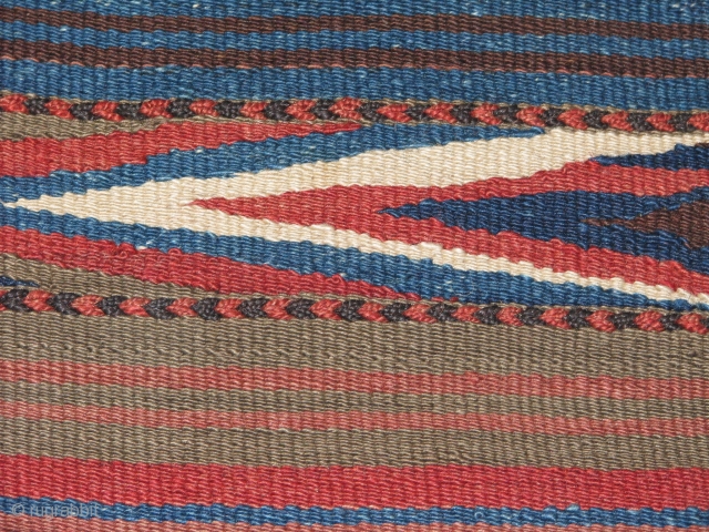 Very lovely wedding(dowry) kilim.Veramin?.it has great colours.the weave is very tite(strong)and between the designed parts to stripe simple parts it has extra embrodry.the base is either goat hair,horse hair?the piece is quite  ...