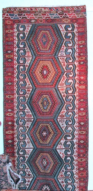 Antique Anatolian kilim, possibly from Aksaray region.
Size: 3,96 x 1,59  Age: Around 1900  
Materials: Wool in warp and wefts, except for all white areas which are in cotton
Technique: Splits covered  ...