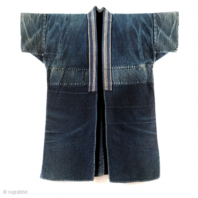 Sashiko Noragi - Shonai Step and Weave

One of the most visually arresting sashiko jackets from my collection. This sashiko noragi is from Shonai, Yamagata prefecture.

The entirety of this jacket is dyed with  ...