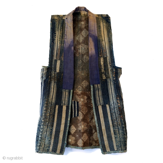 Sashiko Boro Noragi - Sodenashi with Dense Repairs

Extreme sashiko stitching over this vest.

Rustic antique cottons.

Years of use give this sodenashi a very soft feel. 

Suitable for display or wear. 

Early 1900's
Dimensions: 13"  ...
