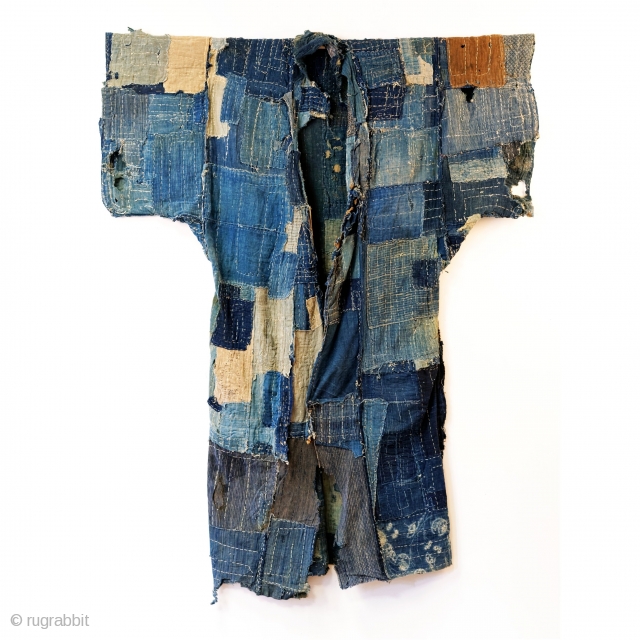 Boro Yogi - Meiji Era Indigo Yogi

An antique heavily worn, repaired and weathered, museum quality boro yogi.

This piece balances a blend of what most collectors seek in boro - a visual aesthetic  ...