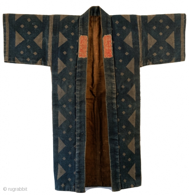 This is a striking antique Japanese fireman's jacket - hikeshi banten. The coat is made from multiple layers of cotton held together with upwards of 100 stitches per square inch.

Typically these jackets  ...