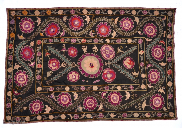 Antique Uzbek Suzani
An early rich Uzbek Suzani with beautiful silk medallions and floral themes on cotton background.
102" x 69"              