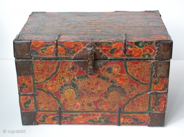 18c embossed zeebag chest, with a central medallion of the mythical zeebag beast and a reddish-orange background with swirls of light yellowish-brown. The painted surface on leather binding is raised lacquer gesso  ...