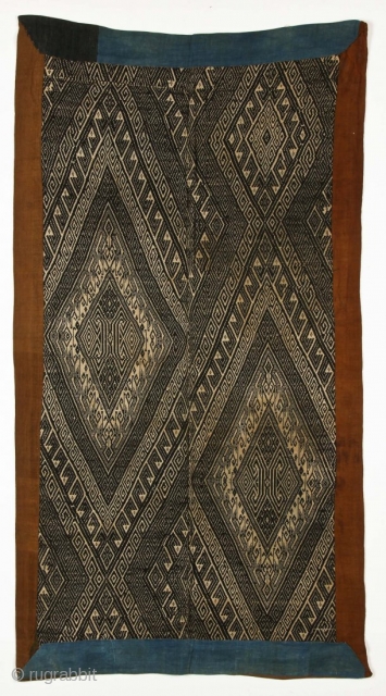 A woven indigo bed cover (Xam Nuea ceremonial blanket), natural dyed cotton, supplementary weave, c. 1900.

33'' x 63'' (84 x 160 cm)           