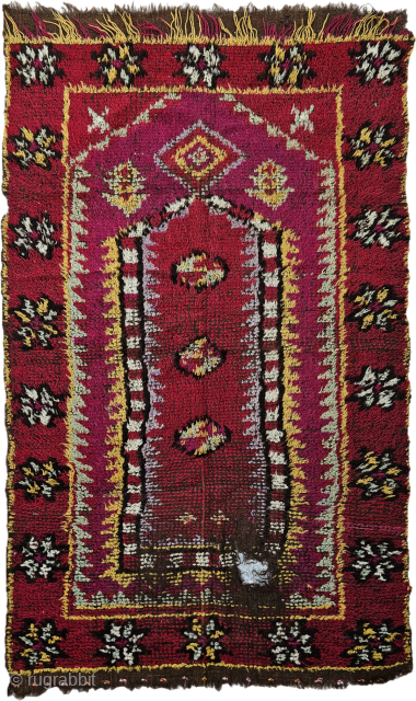 Every rug has a story, but this one breathes history. Woven knot by knot between 1880 and 1890 through the gentle, patient hands of a young girl, this antique prayer rug carries ...