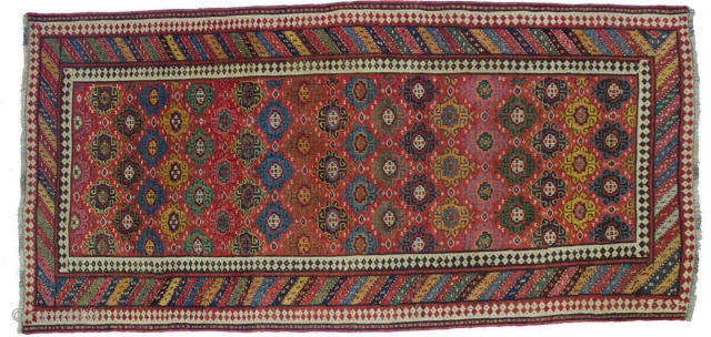 Good Kurdish long rug woven on a wool foundation, Bijar area north west Persia,last quarter 19th ,century,8ft.2in.x4ft.1in.2.49cm.x1.25cm.overall wear with corrosion to Browns,losses to both ends.unusual all over design of rosettes in a  ...