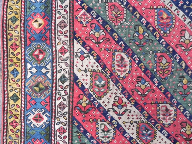 Caucasian Gendje long Rug with diagonal stripes, nice colors (especially the purple), vibrant field with botehs (or earrings), interesting border design with whirling logs?, 4x7.6 ft (122x232 cm), second half 19th century. 