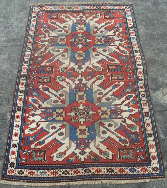 A Chelaberd Rug (so called sunburst or eagle kazak), Karabagh Region in Southern Caucasus, late 19th Century, 4.5 x 7.2 ft.            