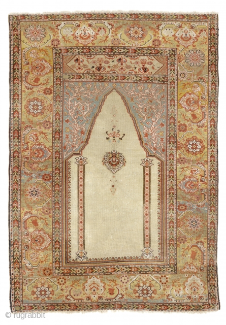 A West Anatolian Prayer Rug with delightful colors, possibly from Ghiordes, 4 x 5.7 ft (121x170 cm), ca late 19th Century. Very good condition, All original as found in France, no repairs.  ...