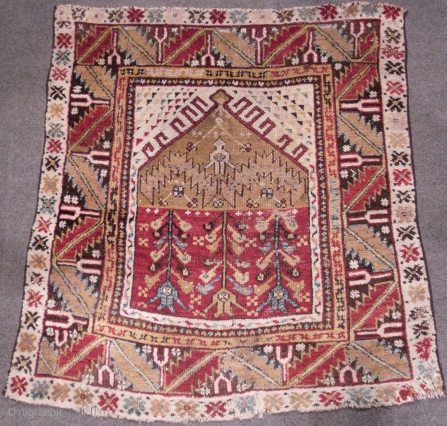 A Central Anatolian Child`s Prayer Rug, 42x40 inches (105x102 cm), sec. half 19th Century, original as found, no repairs.  www.rugspecialist.com            