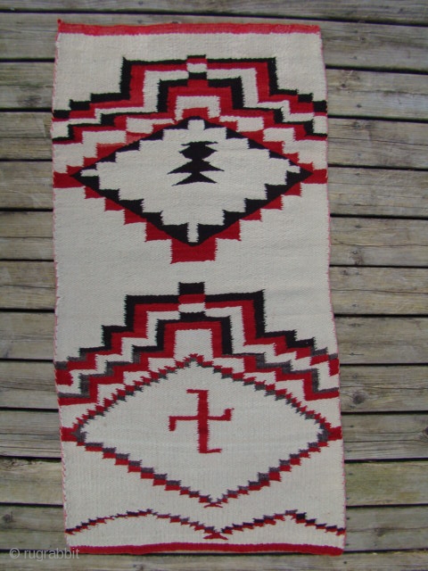 Unusual Navajo weaving that resembles (child's) prayer rugs with stepped prayer arches and stepped diamond mihrabs.
Colors are natural dark brown, natural dark gray plus white and red.
Good wool, great condition.
Size: 20" X  ...
