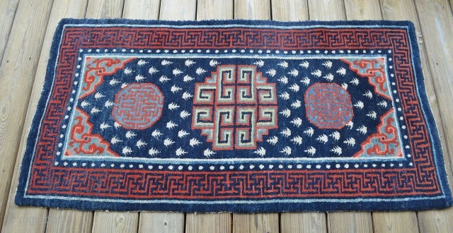 Very nice Tibetan carpet, measures 28 1/2" x 54".  Believe the piece to be around 1900, nice condition.              