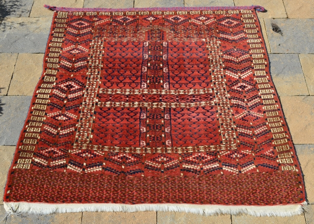 Tekke Ensi, great color and condition, complete with original braided hanging band.  Measures 52" x 46 1/2" Circa 1900-1920.  Recently cleaned.          