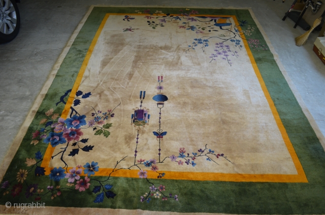 A very nice Nichols Art Deco Chinese rug circa 1920/1930.  Very pleasant neutral beige field.  Some corner damage, please see photos.  9'x12' Needs cleaning      