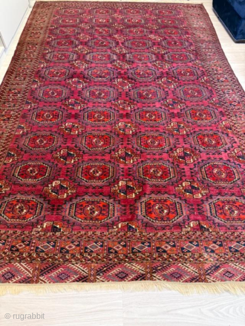 Tekke Turkmen Rug, late 20th century
Size: 320 × 201 cm (10'6" × 6'7")

A large Tekke rug with the traditional repeating gul pattern, framed by multiple geometric borders. The field is dyed in  ...