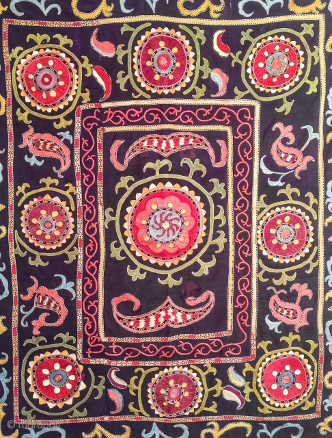 A dynamic Antique Uzbek silk suzani / Susani dating to late 19th Century from rural areas of shahrisabz. It has fine chain stitched silk on a dark indigo silk woven ground. The  ...