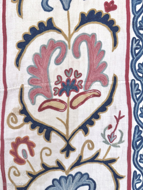 An outstanding antique Uzbek Shahrisabz silk Suzani, showcasing exceptionally fine silk chain-stitched embroidery on an unusual silk blend (?) textured and patterned white ground fabric. Dating close to mid 19th century, it  ...