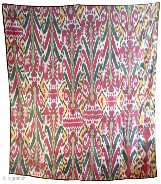 a Large antique Uzbek silk Adras Ikat dating to the 19th century Bulhara or khorezm. The magnificent wall Hanging is an older silk warp cotton weft Ikat. The archaic design of repeating  ...