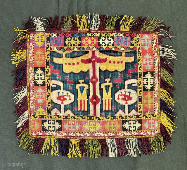 A very rare  and visually stunning antique Uzbek silk velvet Ikat ilgich / ayna khalta made in the 19th century. This is not a repurposed piece but rather an original mirror  ...