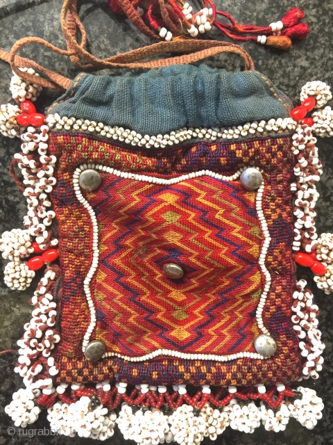 A gorgeous antique silk embroidered and glass bead woven Central Asian bag from Nuristan region of Afghanistan. Ethnographic arts of Nuristan (be it textiles or wood artefacts) are very distinct in comparison  ...
