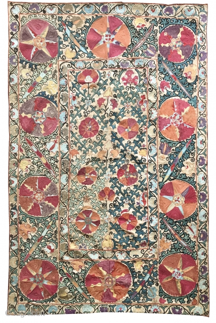 An beautiful Antique Uzbek Bokhara Suzani / Susani dating to the 19th Century. It is fine silk embroidery on Karbos (hand woven cotton) fabric using a chain stitched technique. The lattice floral  ...