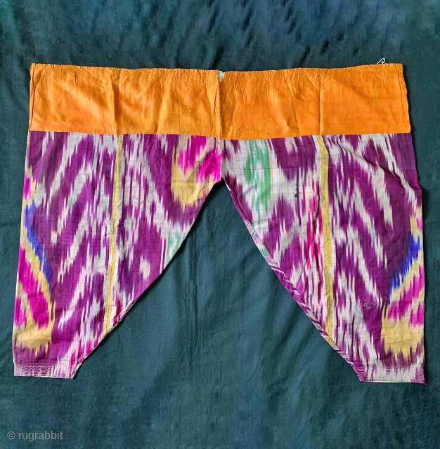 A rare complete antique Uzbek silk warp / silk weft atlas weave Ikat trousers dating to the 19th Century. This highly collectible ethnographic garment is attributed to the city of Bukhara. Such  ...