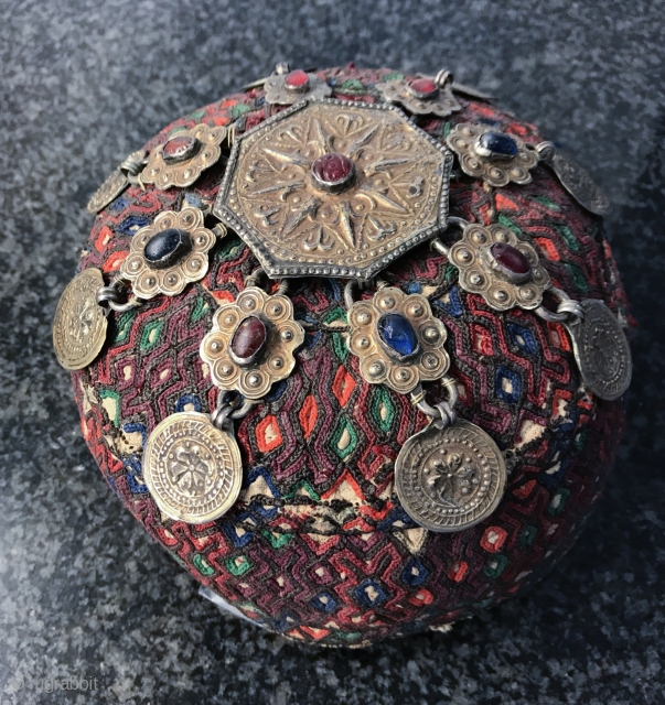 A rare complete antique silk embroidered Yomud / Yomut tribe Turkoman / Turkmen young man / boy's hat with original gold appliqué on silver  talismanic crown. There is a distinctive beauty  ...