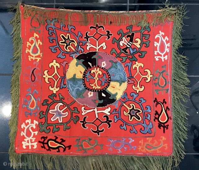 An Exceptional antique Uzbek Lakai Tribe silk embroidered Ilgich / Ayna Khalta hanging dating to the last quarter of 19th century. This particular example is very unique. The medallion with four boteh  ...