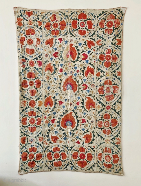 A beautiful antique Uzbek silk suzani from 19th century Bukhara. Boasting a rich floral field design with an array of palmettes, interspersed with vines and smaller floral repertoires. The borders have large  ...