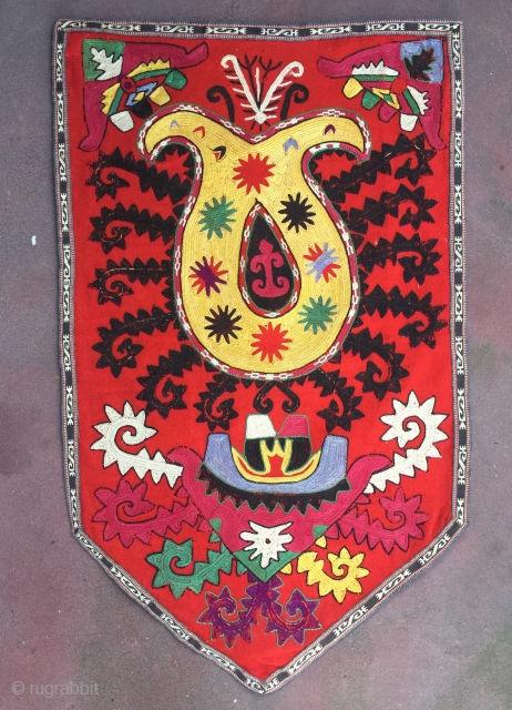 An exceptional Antique Uzbek Lakai Uut kap Ilgich embroidered Suzani. This shield shaped embroidery dates to late 19th century and is an outstanding example.  The fine embroidery is executed with fine  ...