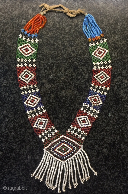 a fine antique glass bead woven Central Asian necklace from Nuristan region of Afghanistan. Ethnographic arts of Nuristan (be it textiles, jewellery or wood artefacts) are very distinct in comparison to other  ...