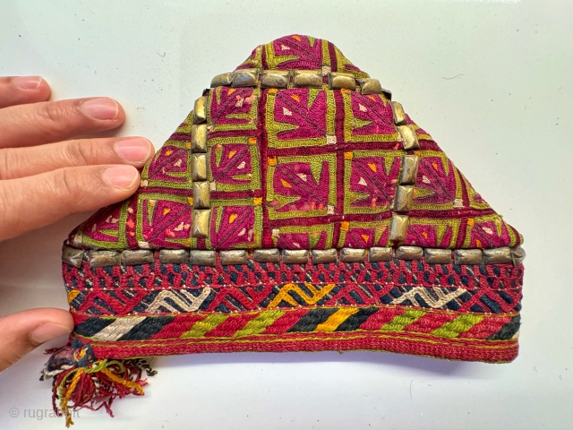No, not a hat. But rather a very rare antique  central Asian Ersari Turkoman / Turkmen silk embroidered and gilded studs carpet comb cover dating to 19th century. Weaving was the  ...