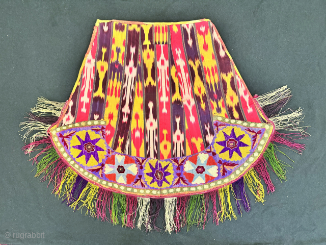 An excellent and very rare antique Uzbek silk embroidered Ikat ceremonial saddle cover, made in rural areas of Shahrisabz during the 19th century. This fine horse cover was a likely a bridal  ...