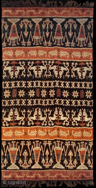 Antique man's wrap, hinggi, from Sumba, Indonesia. Early 20th C. (1900-1925). Warp ikat. Probably from Melolo village. Classic eleven band field division with large shrimp decorating the widest bands. In between are  ...