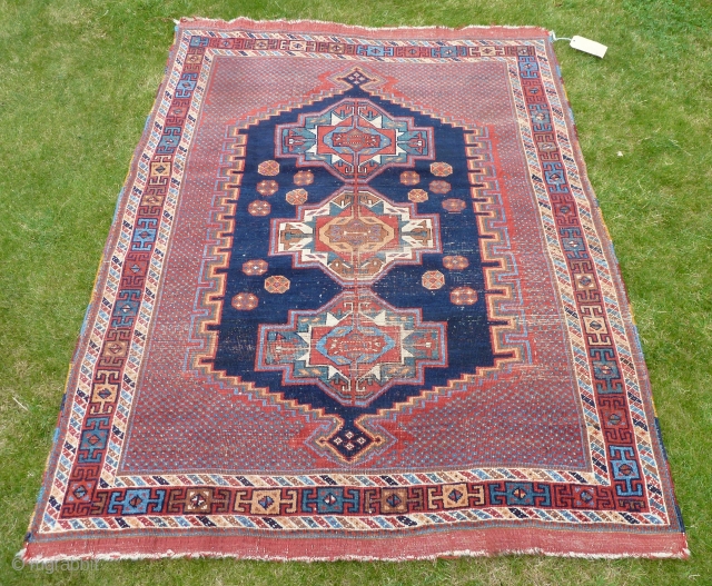 An interesting Afshar rug with three Turkmen guls. Worn but attractive. All good colours, late 19th Century. 5'6" x 4'4" / 168 x 130 cm.        