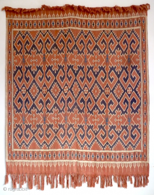 A Toraja Sulawesi ceremonial cloth, joined cotton lengths in warp ikat technique. Indonesia, mid 20th Century. Note the human figures interspersed between the geometric motifs.        