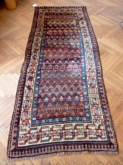 A Moghan Kurdish rug, c. 1900, with excellent long wool and lively boteh design. 271 x 110 cm               