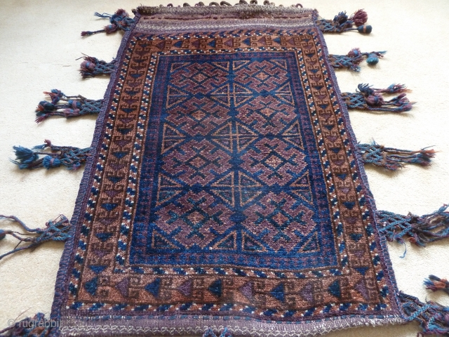 A lush Belouch khorjin, with superb silky long-staple wool and all good colours. Original plainweave back and braided side-tassels. First half 20th Century, size 98 x 63 cm     