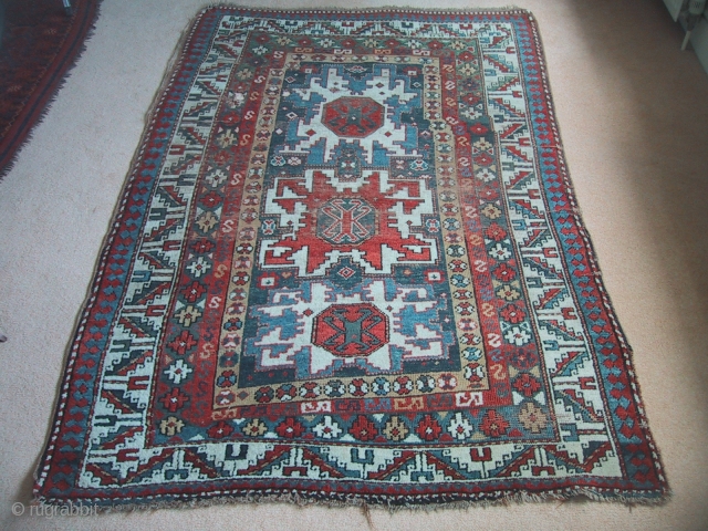 Unusual and charming kazak rug with Lesghi star motifs, 3rd quarter 19th century. Great wool and colours. In fair but untouched condition, all four sides there. Needs a bath and some TLC. 