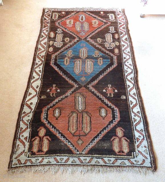 A rare Persian tribal rug, possibly a Bakhtiari khersak. The field is natural dark long staple wool, woven on a handspun cotton foundation. 186 x 100 cm, 6'1"x 3'3".    