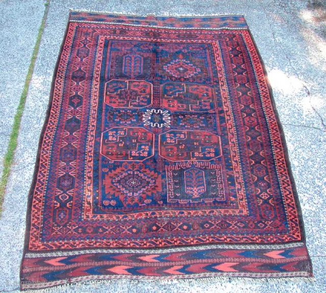 Probably Timuri, Baluch Main Carpet, late 19th century. Very unusual "Gulli Gul" design. Remnants of silk highlights in center flower. Some corrosion of browns, but overall condition is very good. Some minor  ...