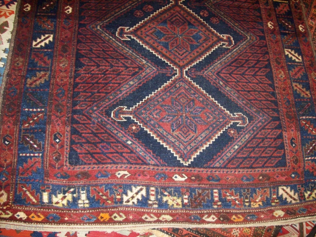 Persian Afshar khoi very good condition 100% wool on wool vibrent colours including synthetic orange.
size 5 * 8 ft APX             