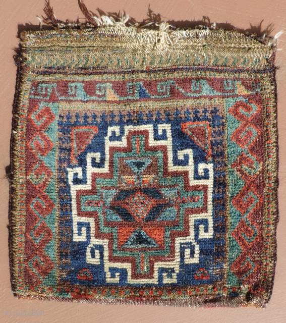 Sweet, primitive, little Baluch saddlebag half with back. 19th century.  Rich, deep indigo blues, striking turquoise hues with strong purples and warm reds.  Very tactile and endearing little piece. Size:  ...