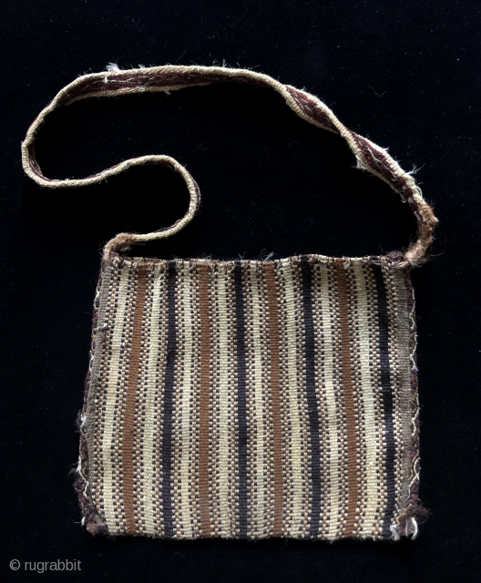Complete warp-faced patterned Andean coca bag.  A.D. 900 - 1200. The design is primal - made by simply alternating warp yarns to create a "zipper-like" pattern.  This is a way  ...